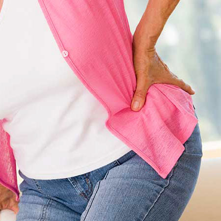 Woman suffering from hip pain in need of chiropractor in Palo Alto