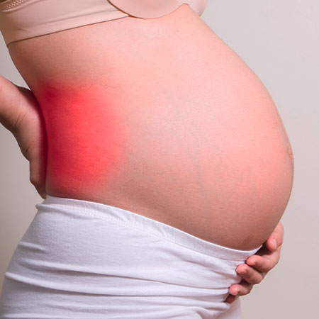 Patient suffering from pregnancy-related pain in need of chiropractor in Palo Alto
